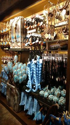 there are many necklaces on display in the store