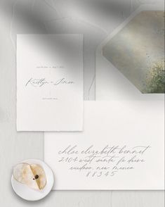 the wedding stationery is laid out and ready to be printed on it's envelope