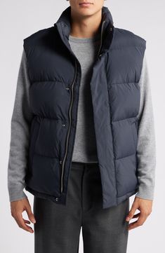 Keeping the core warm is essential in cold weather and this quilted vest made with recycled fibers and down insulation brings sustainable style and lasting comfort to your look. Front zip closure with snap storm placket Stand collar Front slant pockets Water repellent Lined, with down fill (China) 100% recycled polyamide Dry clean Made in China Sustainable Style, Quilted Vest, Puffer Vest, Stand Collar, Repellent, Water Repellent, Cold Weather, Sustainable Fashion, Insulation