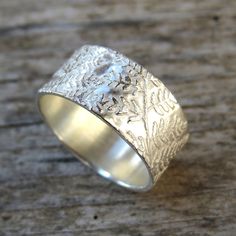 "This delicate fern ring is fully handmade of solid sterling silver. Each ring is a bit different and completely unique. Sterling silver ring is made to your size. The pattern can be darkened for a more vintage, weathered look. This offer is for 1 cm wide ring (width can be made to order, just send me a message and I'll create a special listing for you). Your custom made ring will be prepared and shipped in 7 business days. SIZE: Ring width: 1 cm MATERIAL: Sterling silver PLEASE NOTE: Every piec Handmade Silver Engraved Ring, Nature-inspired, Handmade Nature-inspired Silver Engraved Ring, Silver Nature-inspired Engraved Ring As Gift, Nature-inspired Silver Engraved Ring As Gift, Nature-inspired Silver Rings With Natural Inclusions, Fern Ring, Witchcraft Jewelry, Botanical Ring, Woodland Earrings