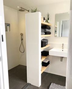 the bathroom is clean and ready to be used as a storage area for toiletries