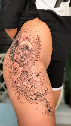 a woman's thigh with flowers on it