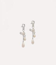 Crafted with silver-tone plating, the Claude Long earrings showcase a rounded pearl with a central orb, accented by a signature safety pin detail - a nod to Vivienne's punk-inspired, non-conformist aesthetic. With a drop silhouette, these earrings are finished with a hardware-inspired clasp and a hinged post for easy closure. Vivienne Westwood Earrings, Punk Inspiration, Luxury Jewellery, Ring Watch, Recycled Silver, Safety Pin, Lace Boots, Vivienne Westwood, Long Earrings