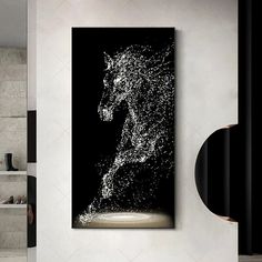 a black and white photo of a horse on the wall in a modern living room