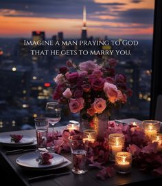 a table with candles and flowers on it in front of a cityscape that says imagine a man praying to god that he gets to marry you