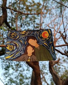 a paper cut out of the starry night with trees in the background