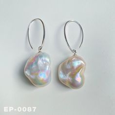 ✿ One picture corresponds to one product  ✿ Item: Large Natural Freshwater Fireball Baroque Earrings ✿ Genuine Freshwater Baroque Pearls: Irregular, natural shapes with unique luster and iridescence. ✿ Pearl Size: 22-24mm（W）   26-27mm（L） ✿ Pearl Color: Natural untreated, White rainbow，with Wonderful iridescent luster ✿ Pearl Shape: Fireball ✿ Accessories material: Solid S925 silver , hallmarked "S925" ✿ The handmade Earrings come in a fine gift bag, Ideal gifts for Valentines' Day, Mother's Day, Anniversary Day and Birthday to your girlfriend, daughter, wife, and mom to express your sincere love. ✿ We strive to provide you with high-quality jewelry, carefully examining the details of every pearl and every metal accessory. We provide customized services. If you have any needs or questions, Silver Drop Earrings With High Luster, High Luster Silver Pear Earrings, High Luster Pear Shaped Silver Earrings, Pearl White High Luster Drop Earrings, Gift Pearl White Baroque Pearl Earrings, Silver Baroque Pearl Earrings, Silver Baroque Pearl Earrings For Gift, High Luster Baroque Pearl Drop Earrings, Silver Baroque Pearl Drop Earrings