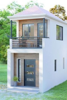 a small house with a balcony on the second floor