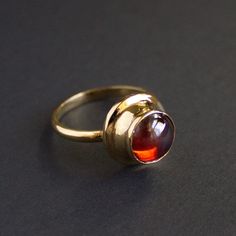 Replica of the Frankish ring, 7th century. Brass, glass stone. Original is stored in the MET museum. 
Please point out the desirable stone color in the notes to your order. Available stone colors: blue, green, red, purple, yellow, light blue. Default stone is red.
NOTE: The ring in the photo is gold plated. Antique Ruby Ring With Bezel Setting, Antique Round Crystal Gemstone Ring, Antique Opal Gemstone Ring, Antique Round Opal Gemstone Ring, Antique Round Opal Ring, Antique Round Cabochon Sapphire Ring, Antique Sapphire Cabochon Ring, Antique Style Round Opal Gemstone Ring, Antique Cabochon Ruby Ring Gift