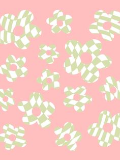 a pink background with green and white checkered shapes in the shape of letters on it