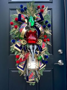 a christmas wreath is hanging on the front door