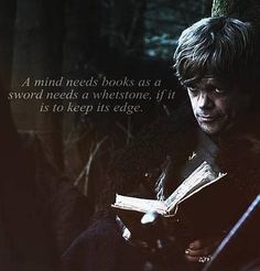 a man holding a book in his hands with a quote from game of thrones