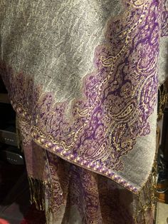 Silvery gray and purple reversible Vintage styled wrap 28 X 70 Nice brocade paisley Very soft silk blend Styled from ancient Jamawar Indian motifs These are replicated from vintage shawl collections by my own company We may have larger quantities available for weddings, bridesmaids, or wholesale orders. Please inquire. All shipped free in the US Please check out our THOUSANDS of great reviews Traditional Purple Pashmina Shawl, Purple Pashmina Shawl, Purple Pashmina Scarves, My Own Company, Indian Motifs, Vintage Shawl, Purple Paisley, Vintage Shawls, Wrap Shawl