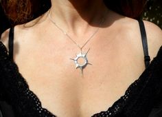 "The mysteries of our solar system always get our imagination aroused. Watching a solar eclipse gives us this feeling of us being part of a great universe. When the moon blocks the sun it is a rare, fascinating, magical moment. I love to carry this moment around with me ----Details---- A solar eclipse pendant from solid sterling silver hand carved using the lost wax method. hole diameter: 11mm 0,43inch comes on a 18 inch/ 45cm long black sterling silver chain.If you would like a 20 inch / 50cm l Sterling Silver Necklace With Sun Design, Sterling Silver Sun Design Jewelry, Silver Sun Design Jewelry As A Gift, Unique Round Jewelry With Sun Design, Unique Round Sun Design Jewelry, Sterling Silver Jewelry With Sun Design, Unique Sterling Silver Sun And Moon Jewelry, Eclipse Jewelry, Eclipse Necklace