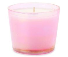 a pink candle sitting on top of a white table