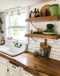 the kitchen counter is clean and ready to be used as a shelf above the sink