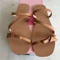 Brand New In Box Tan Color Kate Spade Sandals. Kate Spade Leather Beach Sandals, Kate Spade Flat Beach Sandals, Kate Spade Flat Sandals For Vacation, Kate Spade Leather Sandals For Beach, Kate Spade Leather Sandals For Vacation, Kate Spade Flat Sandals For Beach, Kate Spade Open Toe Sandals For Vacation, Kate Spade Summer Sandals For Vacation, Chic Kate Spade Synthetic Sandals