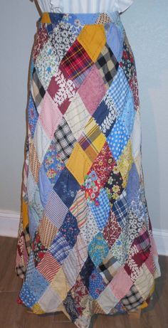 a woman's skirt made out of patchwork fabric