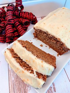 a slice of carrot cake on a white plate