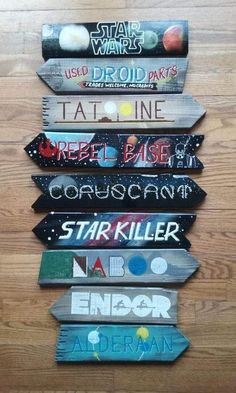 a collection of star wars themed wooden signs on a wood floor with the names of them