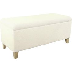 an upholstered bench with wooden legs and a white cover on it's back