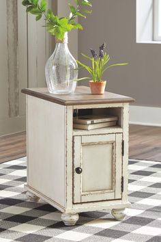 This chairside end table is traditional cottage styling made for modern living. Antiqued two-tone finish blends a chipped white with a distressed wood finished top for a double serving of charm. Cleverly placed AC power outlets and USB charging ports are beautifully in tune with your high-tech needs. Made of wood, engineered wood and veneers Antiqued two-tone finish Open display shelf Cabinet storage with shelf Dark bronze-tone finished metal hardware 2 electrical outlets and USB charging ports French Country Chairs, Open Display Shelf, Brown Chair, Traditional Cottage, Coffee Table With Drawers, Side End Table, Style Cottage, End Table Sets, Chair Side Table