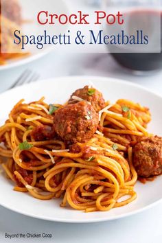 spaghetti and meatballs on a white plate with the title crock pot spaghetti and meatballs