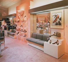 the inside of a shoe store with high heeled shoes on display