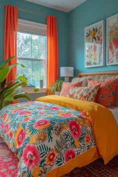 a bedroom with blue walls, orange curtains and colorful bedding in front of a window