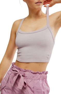 A cropped, racerback cut defines this rib camisole that's always ready for layering, lounging, lunging, lay-ups—you get the idea. 14" length (size Medium/Large) Scoop neck Racerback 87% polyamide, 13% elastane Dry clean or machine wash, dry flat By Free People; made in Turkey Seamless Racerback Crop Top For Loungewear, Spring Crop Top With Built-in Bra For Gym, Bra Friendly Racerback Crop Top For Loungewear, Spring Crop Top Sports Bra For Loungewear, Versatile Crop Top With Tank Straps For Spring, Spring Cami Sports Bra With Seamless Construction, Spring Racerback Crop Top For Loungewear, Spring Loungewear Racerback Crop Top, Spring Cropped Sports Bra With Medium Support