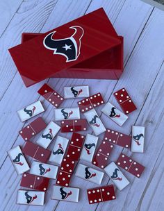 red and white dominos are scattered around a box