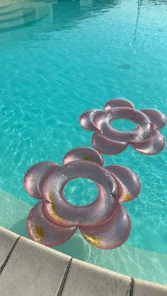 an inflatable object floating on top of a swimming pool