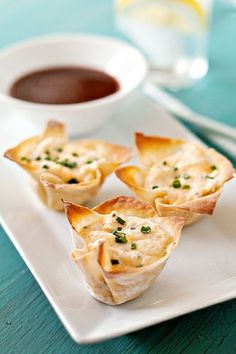 small appetizers are sitting on a white plate