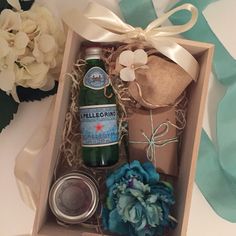 a bottle of wine and some other items in a box