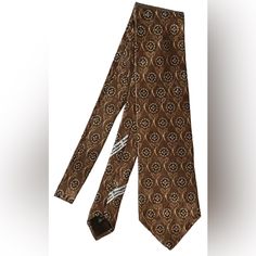 Elevate Your Style With This Luxurious Ermenegildo Zegna 100% Silk Neck Tie Featuring A Classic Brown Medallions Pattern. Handmade In Italy With The Finest Silk Fabric, This Tie Exudes Sophistication And Elegance, Perfect For Any Formal Occasion. The Attachment Type Is Tied, And The Item Width Is Classic, Ensuring A Comfortable Fit For Any Gentleman. This Tie Is A Perfect Addition To Any Man's Wardrobe, And Its Timeless Design Will Never Go Out Of Style. No Returns - No Refunds - No Cancellations Silk Mark Certified Ties For Business, Luxury Business Suit And Tie Accessories, Designer Ties For Formal Occasions, Classic Silk Mark Certified Ties, Luxury Brown Suit And Tie Accessories For Semi-formal Occasions, Luxury Brown Suit And Tie Accessories For Business, Formal Brown Suit And Tie Accessories, Vintage Suit And Tie Accessories For Business, Tie Men's