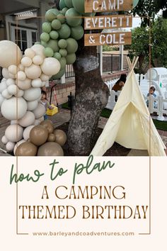 an image of a birthday party with balloons and teepees on the tree in front of it