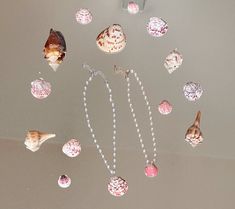 🐚𓇼 Introducing our new Handmade Dainty Seashell Necklace, a breathtaking fusion of coastal elegance and artisan craftsmanship picked straight from the beautiful shores of Florida. Each necklace features a carefully hand-selected seashell of your choice, and beautifully complemented by your preferred gold or silver pearl chain type. If you have a preferred color of shell (pink, purple, orange), please just let me know. 🐚𓇼 𖦹LIMITED SUPPLY!𖦹 Ocean-inspired Shell Necklace Gift, Handmade Ocean-inspired Shell Necklace, Mother Of Pearl Shell Strand Gift, Mother Of Pearl Shell Strand As Gift, Handmade Ocean-inspired Shell, White Shell Necklace As Gift, Ocean-inspired Pearl Shell Necklace, Elegant Handmade Shell Strand, Ocean-inspired Shell Necklace