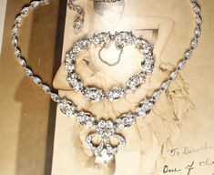 "I am SO excited to be offering this beyond exquisite high-end designer \"BOGOFF\" signed vintage Art Deco 1940s era Old Hollywood Glam clear crystal rhinestone necklace and bracelet  set!   \"Bogoff\" opened its doors in early 1940 and is known for their Art Deco designs, quality material, and excellent craftsmanship. (When Bogoff jewels originally sold, they came with a life time guarantee.)  Photos honestly, don't even begin to do this set justice or capture the amazing sparkle adequately.  T Vintage Rhinestone Jewelry For Vintage Events, Victorian Jewelry With Rhinestones For Vintage Events, Vintage Jeweled Necklaces For Wedding, Vintage Jewelry With Sparkling Stones For Vintage Events, Vintage Crystal Necklaces For Weddings, Vintage Silver Bridal Necklace, Vintage Crystal Bridal Necklace, Vintage Silver Bridal Necklace With Jewels, Vintage Wedding Necklaces With Sparkling Stones