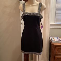 This Is A Party Dress From Forever 21. It Is Black And It Has A Thick Diamant Rhinestone Trim On The Top And Bottom. The Dress Is Heavy And The Diamant Are Well Attached. The Sleeves Are Not Adjustable And If You Are Small Chested Like Me, They Will Not Stay Up. It Is Also Body Con And Is Tight On Me - 90lbs. I Am 5ft And The Dress Is Midi On Me So It Will Be Mini For Most. The Dress Is Stunning And Unused With Tags. Forever 21 V-neck Mini Dress For Night Out, Forever 21 V-neck Mini Dress For Evening, Rhinestone Trim, Forever 21 Dresses, Forever 21, Black Silver, Tights, Party Dress, Colorful Dresses