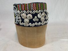 This is a very unusual hat/headdress worn by someone in Borneo and a great piece of folk art. It is decorated with traditional scary bead designs and shells. I purchased this many years ago in Borneo and think it was vintage then. It sits high on my head which is a normal size and maybe that's the way it is supposed to be. Inside lining is a fabric. S&H&Insurance included. Bohemian Hat Band For Festivals, Traditional Multicolor Beaded Hat Band, Unique Handmade Hat Bands For Beach, Bohemian Beaded Ceremonial Headpiece, Handmade Vintage Beach Costume Hats And Headpieces, Traditional Multicolor Beaded Hat, Multicolor Bohemian Hat With Bead Caps, Traditional Handmade Headband, Unique Handmade Ceremonial Headpieces