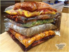 a stack of wrapped food sitting on top of a wooden table