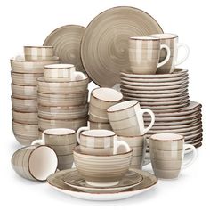 a stack of plates, cups and saucers on a white background