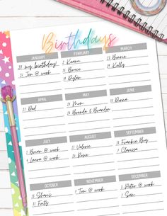 a birthday planner on top of a desk next to a pen and paper with writing