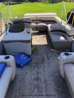 the inside of a pontoon boat with two seats and one seat folded down on the ground