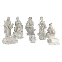 a group of white figurines sitting next to each other