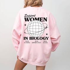 Calling all biology baddies - this crewneck is features retro typography and Y2K inspired graphics. Perfect for the lab or for casual everyday wear, this graphic sweatshirt would make a perfect gift for a fellow woman in STEM! This classic, unisex crewneck will fit like a well-loved favorite from its first wear. Our ultra soft Gildan crewnecks feature... 🖤 Medium weight fabric with a 50/50 cotton & polyester blend 🖤 Tear away label and no side seams 🖤 True to size fit - available in a range o Female Biologist Aesthetic, Women In Stem Shirt, Women In Stem Stickers, Girl Scientists, Chemistry Shirt, Biology Major, Feminist Hoodie, Scientist Gifts, Women Scientists