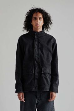 Sunflower fatigue jacket - black washed    this fatigue jacket is crafted from 100% cotton in distressed washed black denim offering a rugged and worn-in look. it features metal button closures and front pockets with button closures for added functionality. the stone-washed finish enhances the vintage-inspired style Black Cotton Denim Jacket With Flap Pockets, Washed Black Cotton Outerwear With Relaxed Fit, Relaxed Fit Washed Black Cotton Outerwear, Relaxed Fit Cotton Outerwear In Washed Black, Black Cotton Utility Jacket For Streetwear, Washed Black Cotton Outerwear With Pockets, Cotton Outerwear With Pockets In Washed Black, Washed Utility Jacket For Winter Streetwear, Winter Washed Utility Jacket For Streetwear