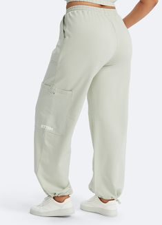 Embrace roomy wide legs and a stretchy fit for ultimate comfort, paired with a flattering high waist for added style. Whether it's grocery runs, lazy Sundays, or a casual hangout, these joggers have you covered in relaxed elegance. Stretch Bottoms With Cargo Pockets For Loungewear, High Waist Relaxed Fit Leisure Bottoms, Comfortable Wide Leg Bottoms For Streetwear, Athleisure Bottoms With Cargo Pockets For Leisure, Relaxed Fit Full-length Parachute Pants For Loungewear, Leisure Cargo Bottoms In Athleisure Style, Relaxed Fit High-waisted Cargo Pants For Loungewear, Relaxed Fit High Waist Athleisure Bottoms, Relaxed Fit High Waist Bottoms For Athleisure