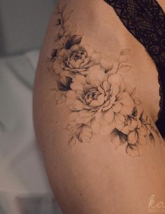 a woman's stomach with flowers on it