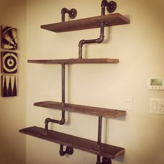 the shelves are made out of wood and pipes